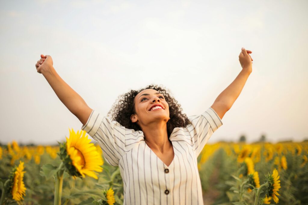 A girl raising her both hands in V pose