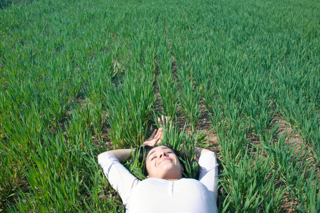 A girl sleeping in grass